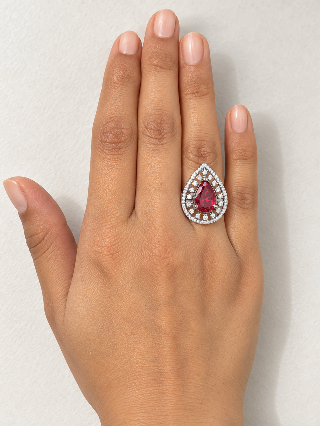 ELVION Red Open Halo Pear Ring — Close-up detail