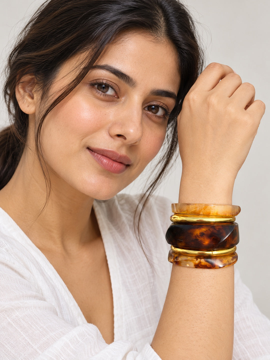 ELVION Brown Gold-Tone Bangle Set — Model wearing product