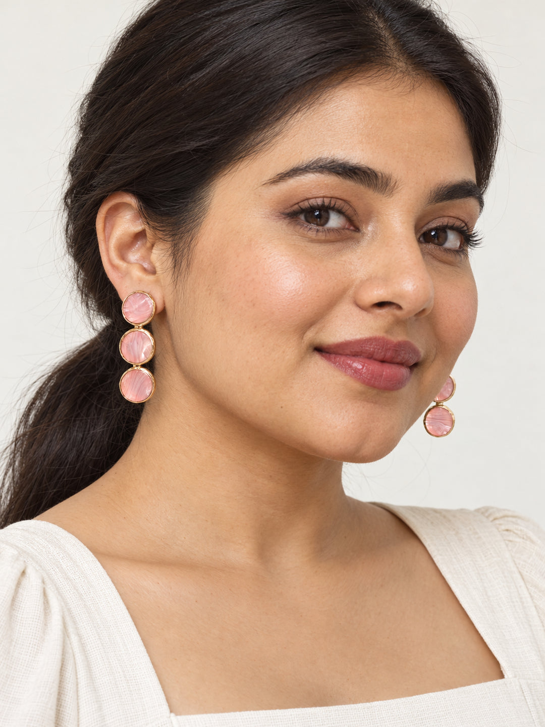 ELVION Pink Triple Disc Earrings — Model wearing product