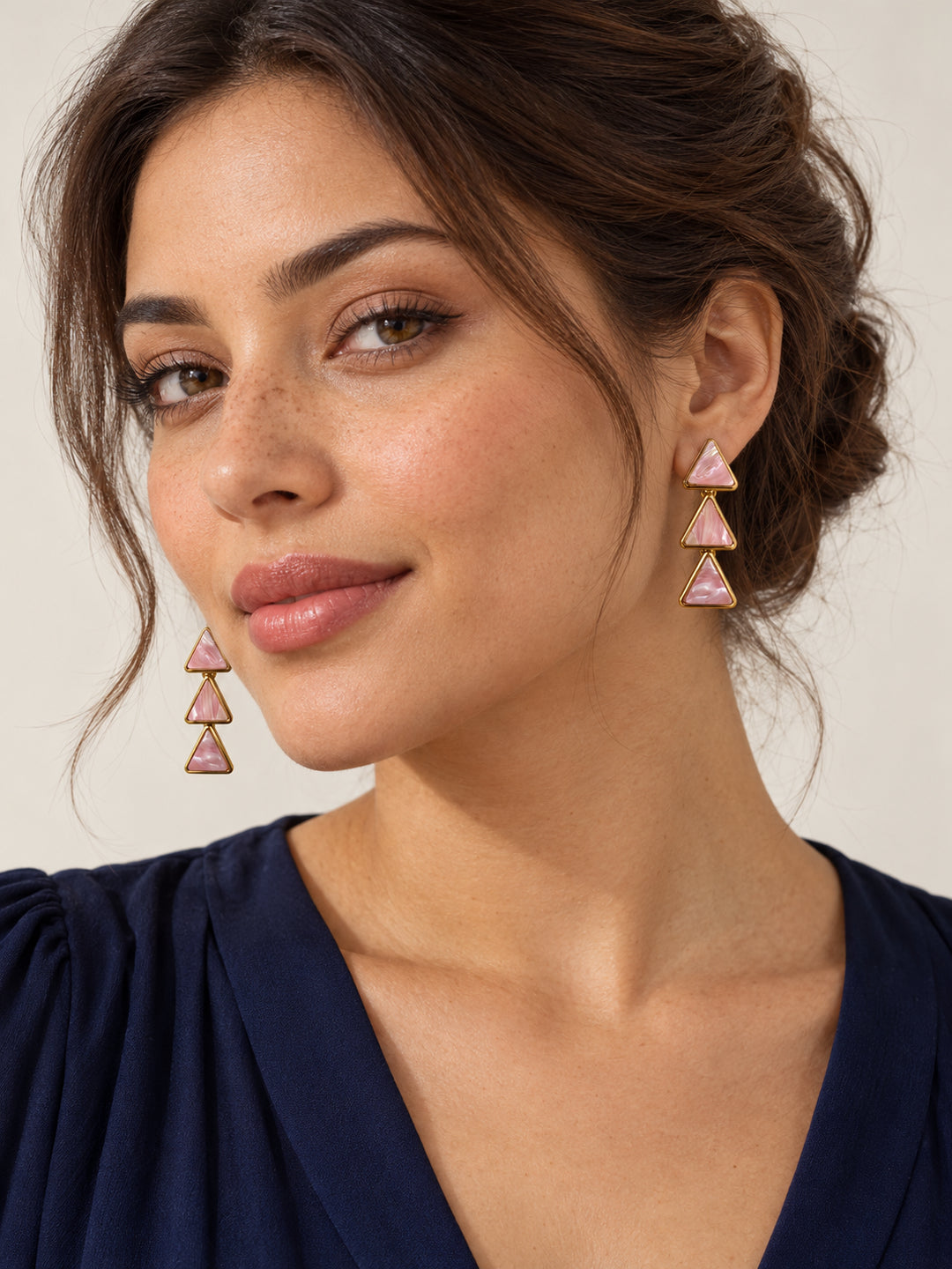 ELVION Pink Triangle Drop Earrings — Model wearing product